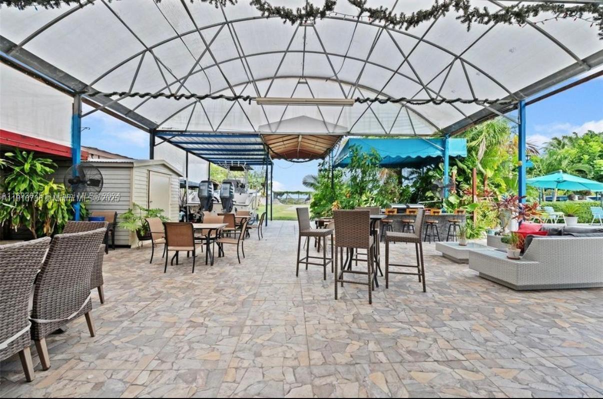 20235 Southwest 172nd Avenue Miami, FL 33187 - Photo 26 of 30 a view of outdoor space with dining table and chairs