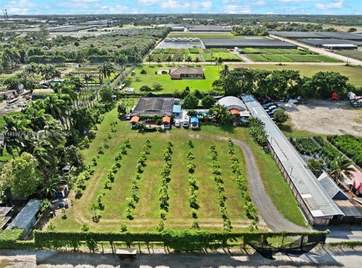 20235 Southwest 172nd Avenue Miami, FL 33187 - Photo 27 of 30 an aerial view of a yard with swimming pool