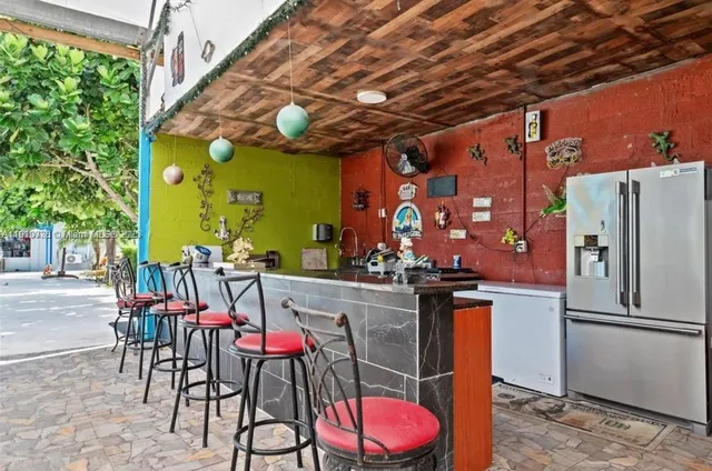 a view of a tables and chairs in patio