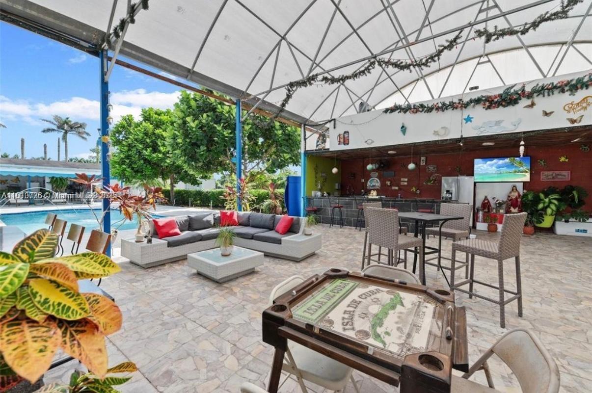 20235 Southwest 172nd Avenue Miami, FL 33187 - Photo 29 of 30 a view of a tables and chairs in patio