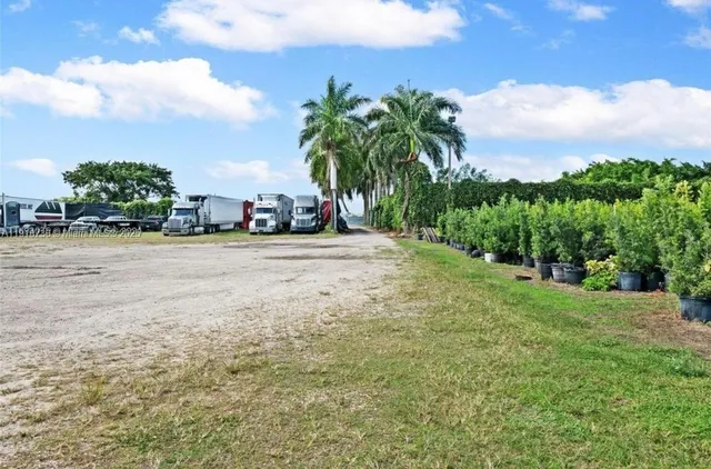 a view of a street with a building in the background