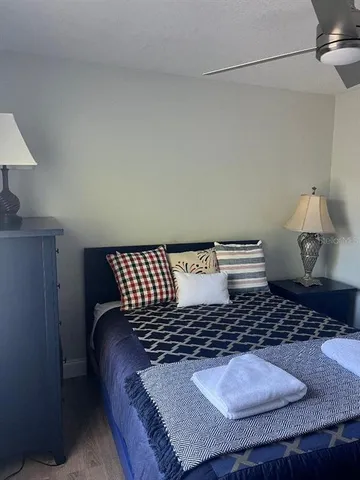 a bedroom with a bed and a table