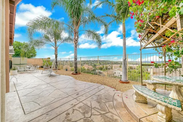 a view of a swimming pool with a lounge chairs