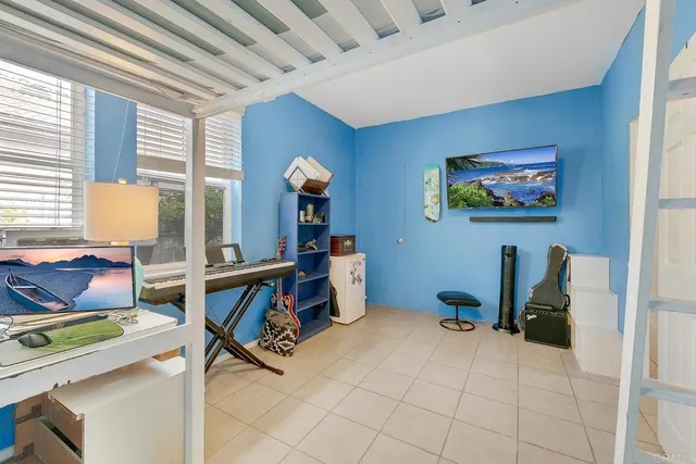 a room with furniture and a flat screen tv