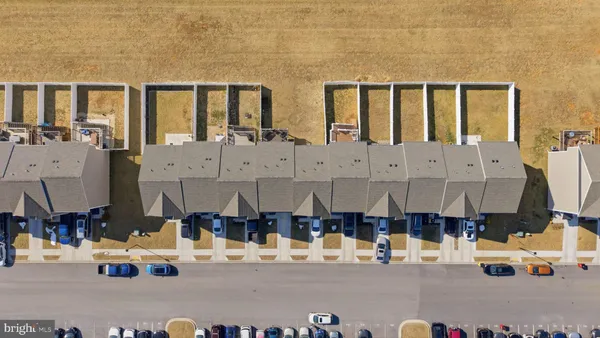 a front view of a house with large windows