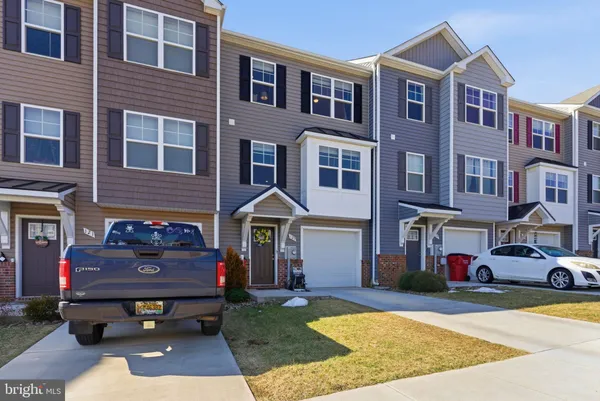 a front view of a building with garden