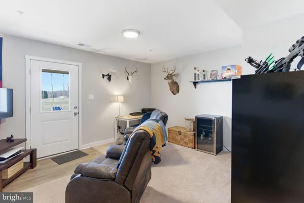 a bedroom with furniture and a lamp