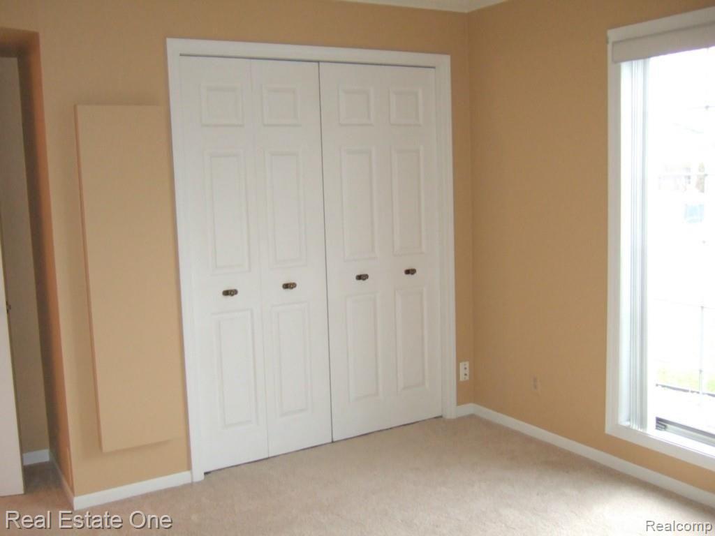 416 North Helen Avenue, Unit 1 Rochester, MI 48307 - Photo 17 of 28 Second Bedroom w/ pull down ironing board