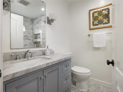 a bed room with a bed and a chair