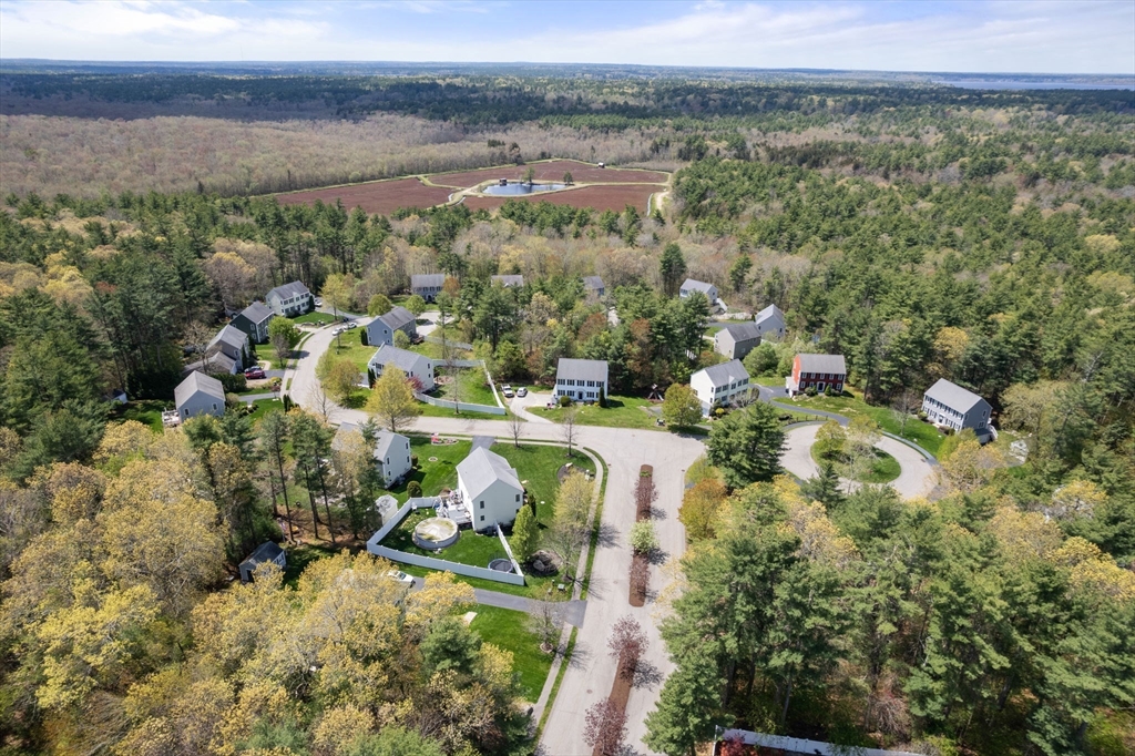 45 Cinnamon Ridge Circle Middleboro, MA 02346 - Photo 37 of 38 an aerial view of a house with a yard and lake view