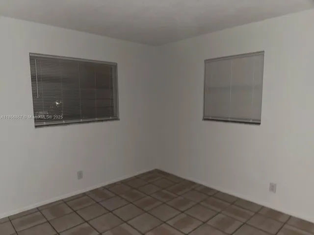 a bathroom with a sink a toilet a mirror and shower