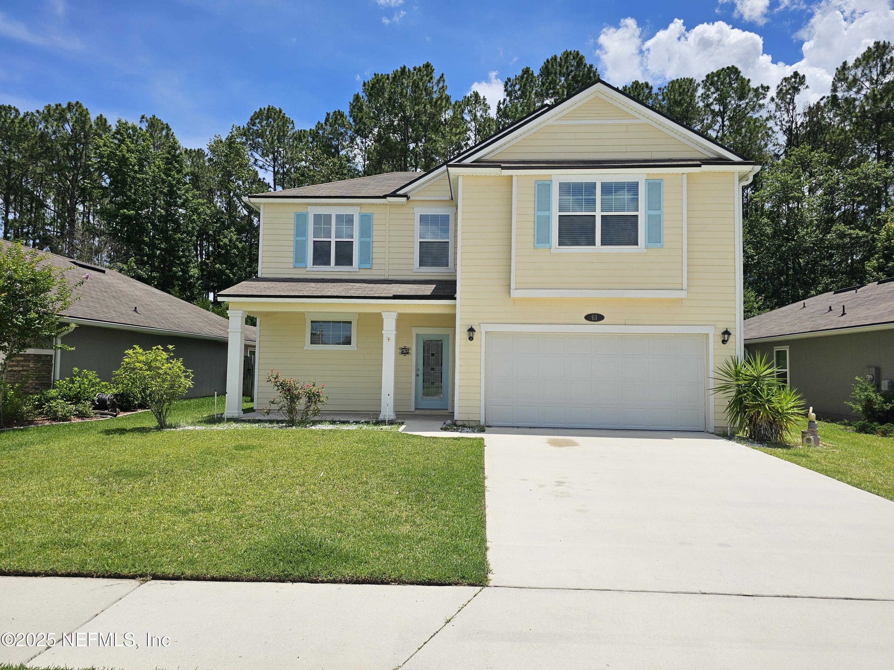 a front view of a house with a yard