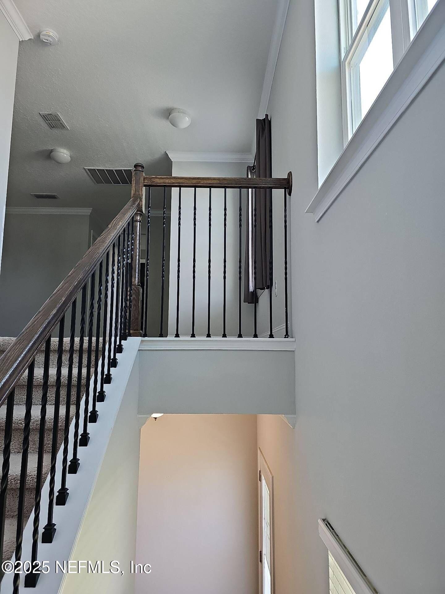 61 Boulder Rock Way St. Augustine, FL 32092 - Photo 12 of 20 a view of staircase with wooden floor and stairs