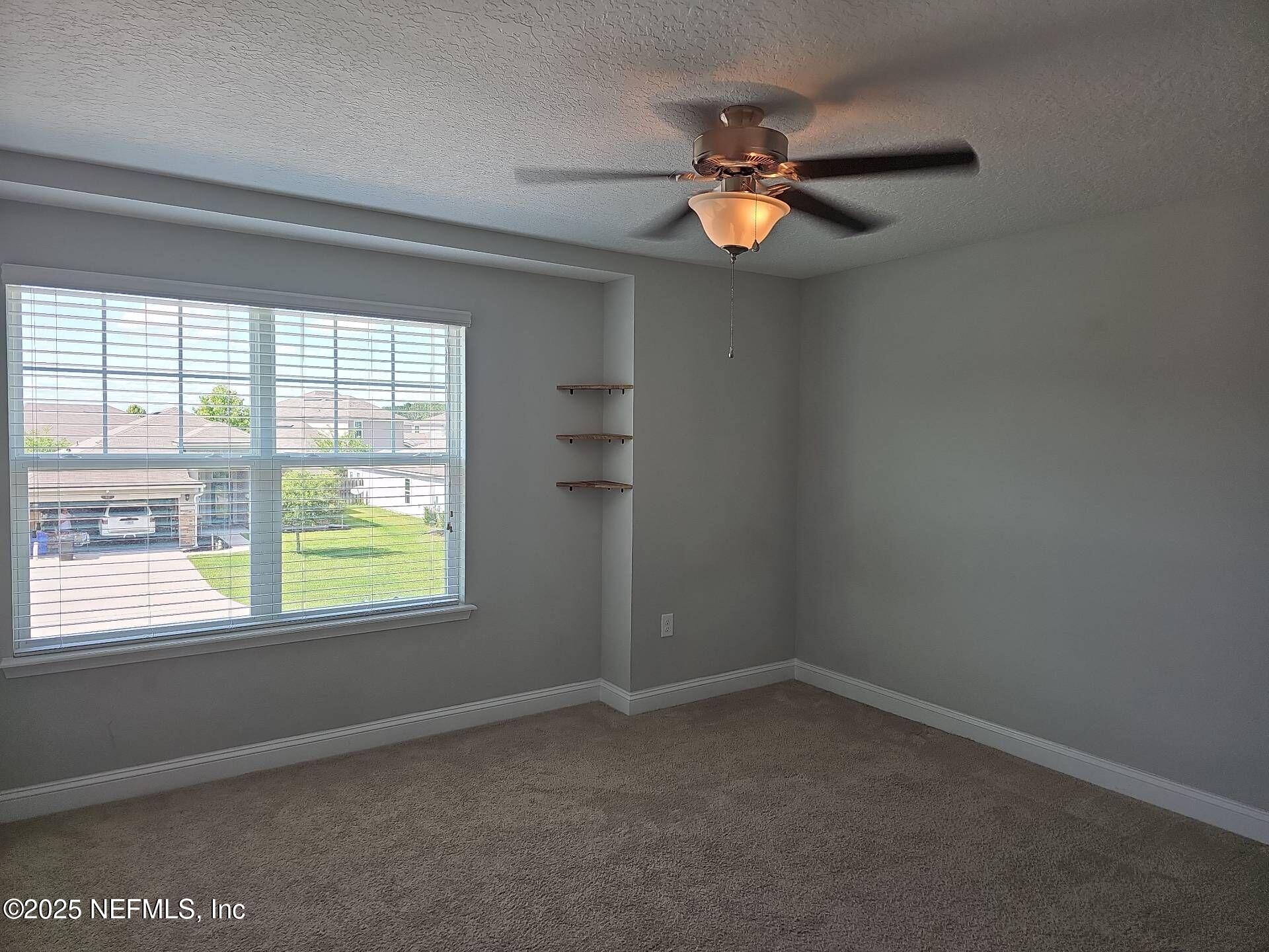 61 Boulder Rock Way St. Augustine, FL 32092 - Photo 14 of 20 an empty room with a window