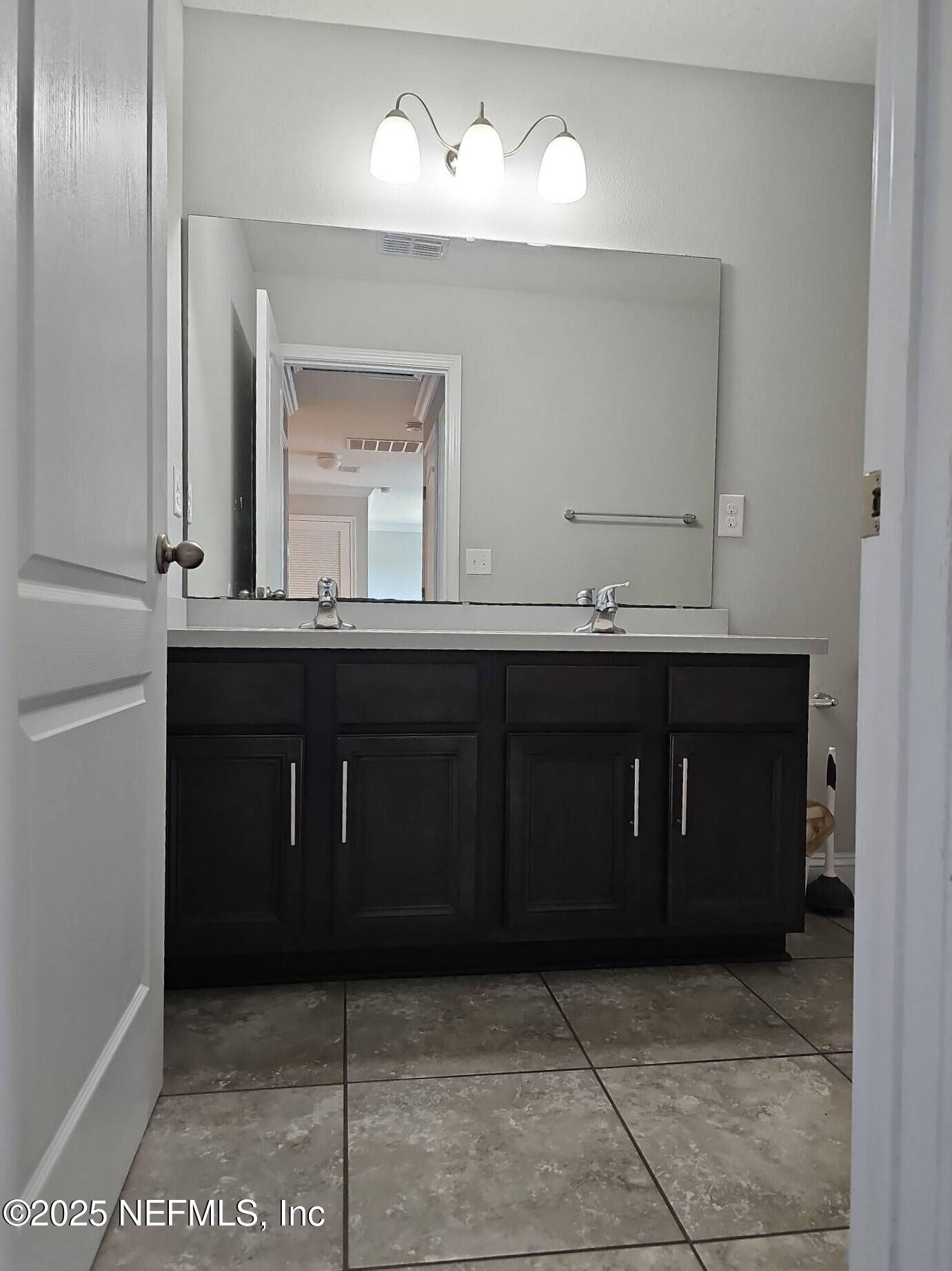 61 Boulder Rock Way St. Augustine, FL 32092 - Photo 15 of 20 a bathroom with a sink and a mirror