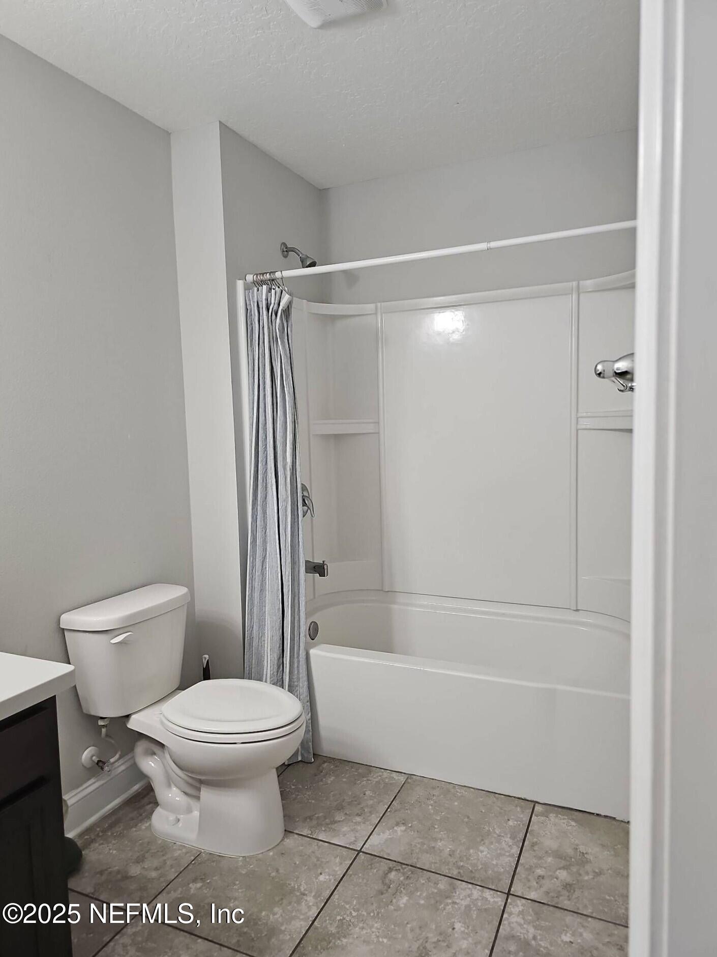 61 Boulder Rock Way St. Augustine, FL 32092 - Photo 16 of 20 a bathroom with a toilet and a shower