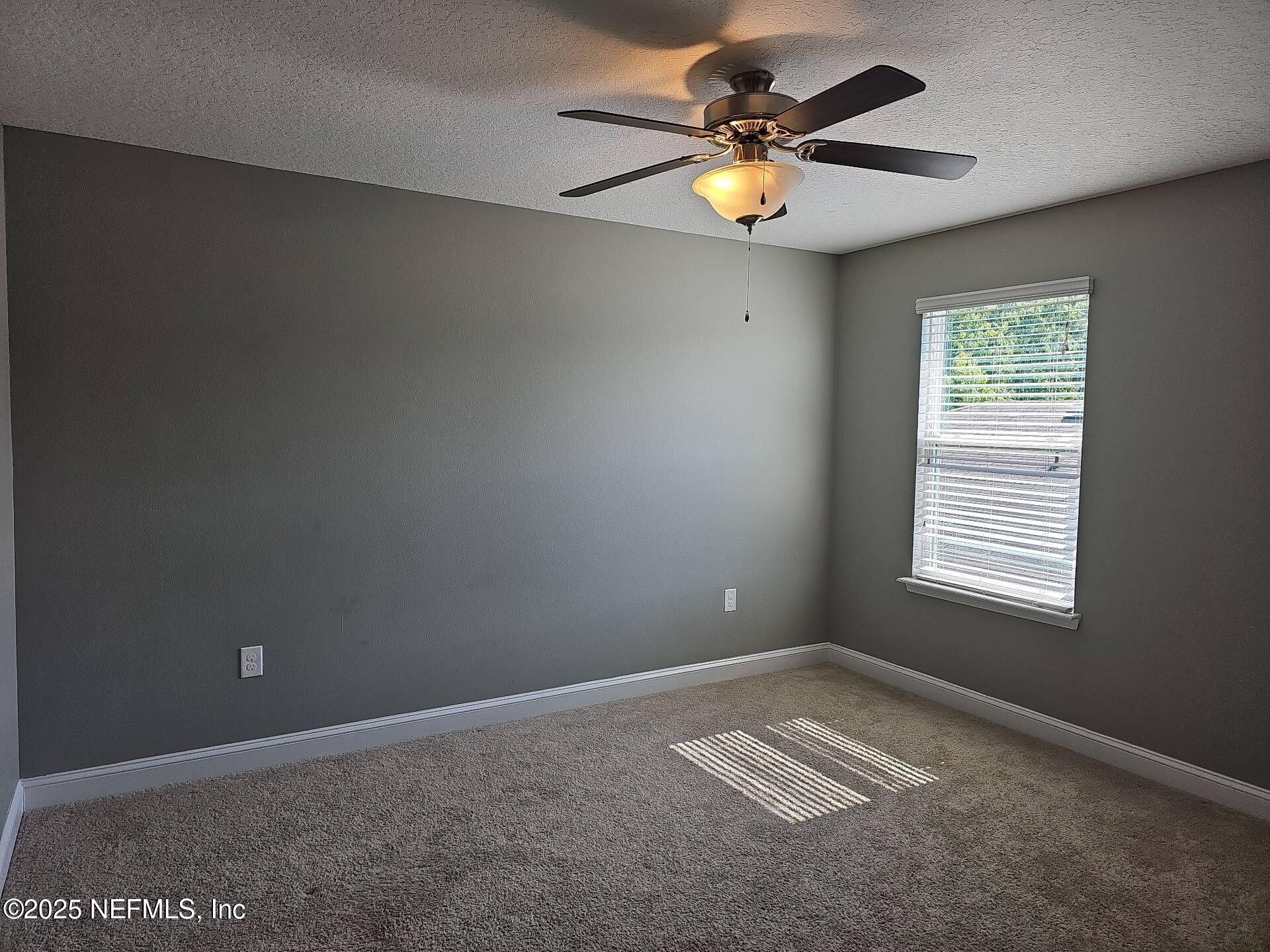 61 Boulder Rock Way St. Augustine, FL 32092 - Photo 17 of 20 a view of an empty room with a window