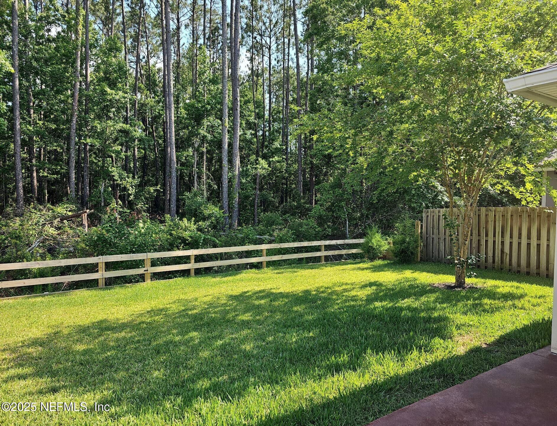 61 Boulder Rock Way St. Augustine, FL 32092 - Photo 20 of 20 a view of a swimming pool with a yard