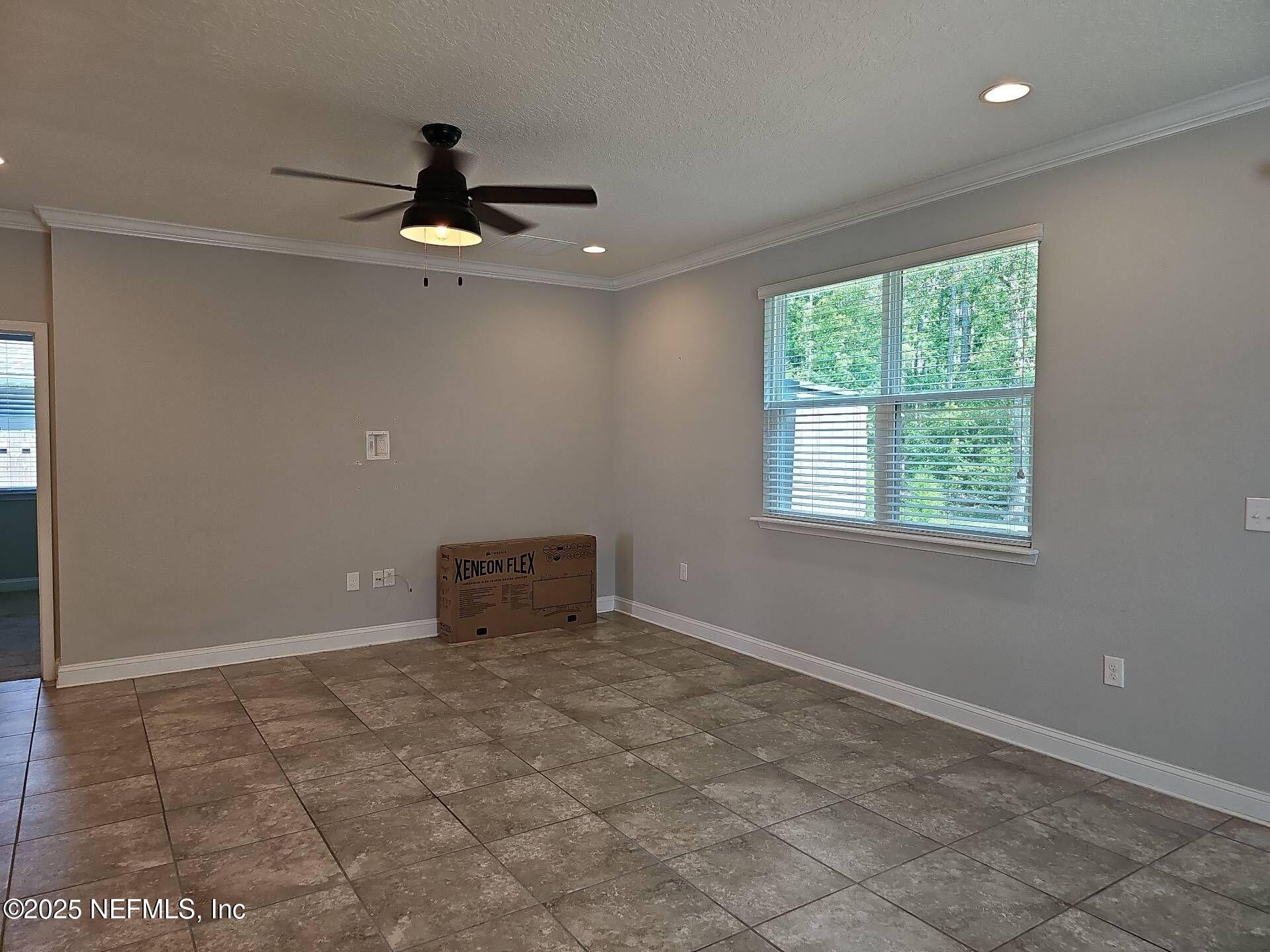 61 Boulder Rock Way St. Augustine, FL 32092 - Photo 5 of 20 a view of an empty room with a window