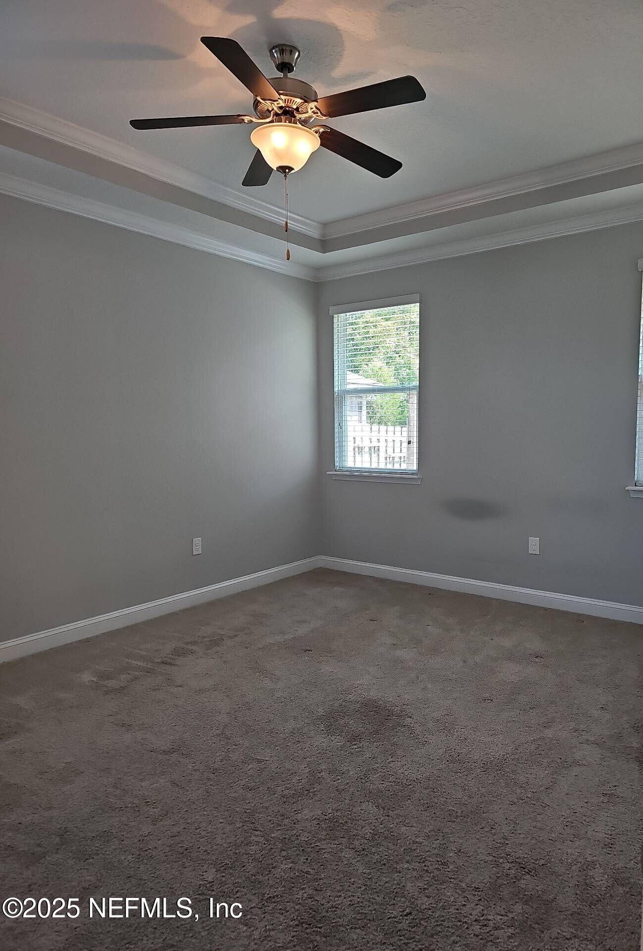 61 Boulder Rock Way St. Augustine, FL 32092 - Photo 7 of 20 en empty room with windows and ceiling fan