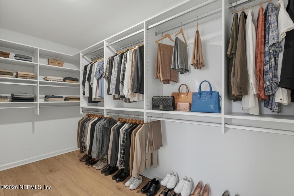 45 Seaport Breeze Road St. Augustine, FL 32095 - Photo 62 of 88 a view of walk in closet with clothes and shoes