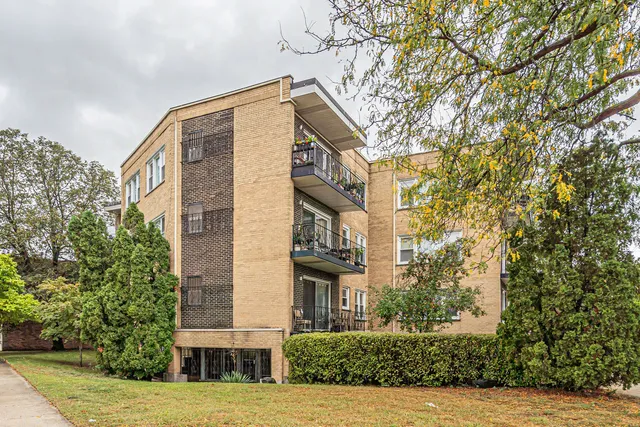 a view of a building with a tree