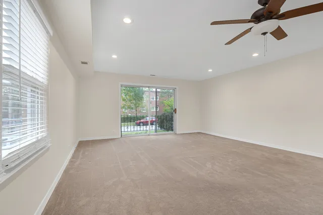 a view of an empty room with a window