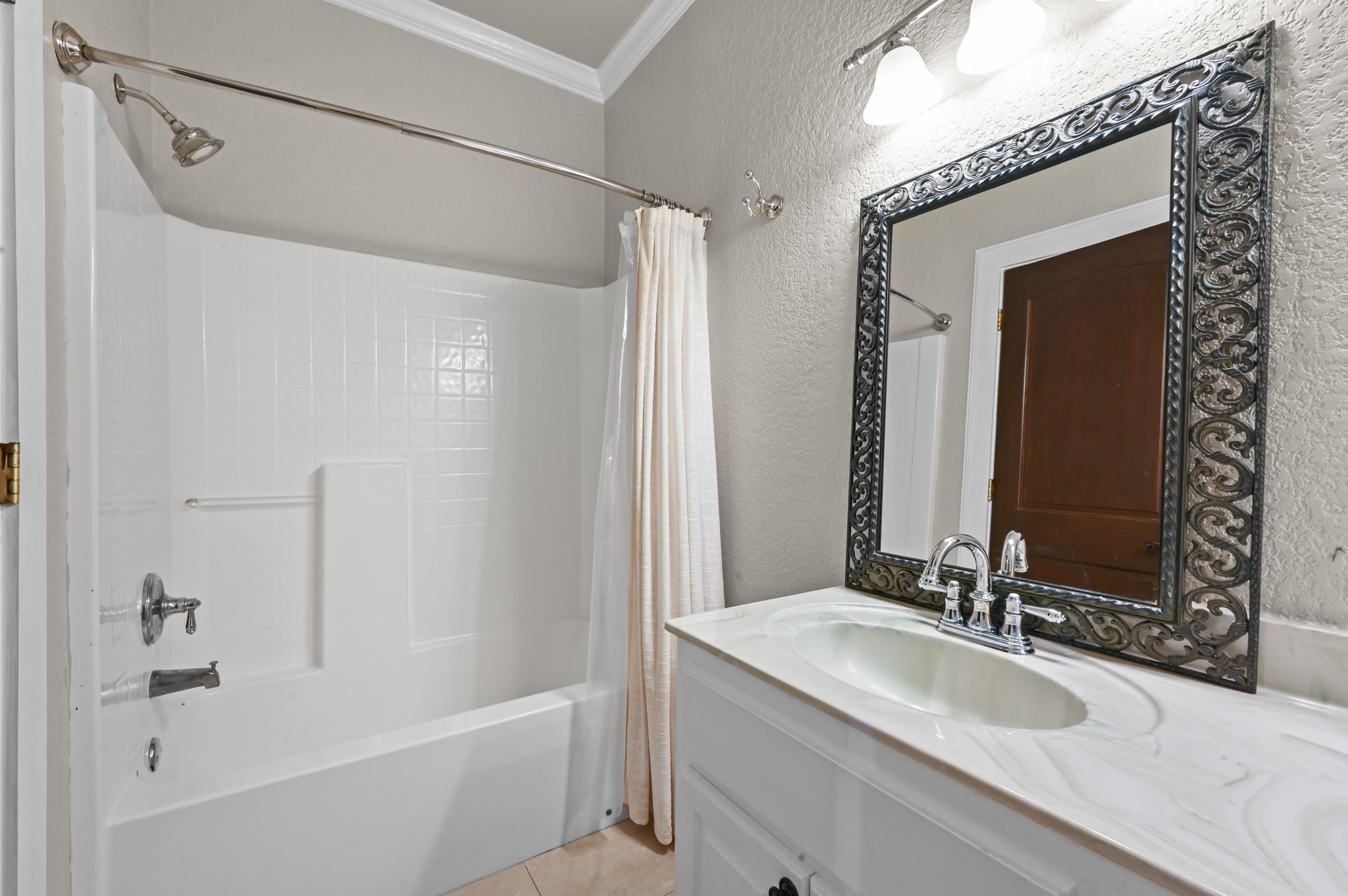 1175 Southern Way Luling, TX 78648 - Photo 32 of 40 A well-appointed bathroom with a classic vanity and shower/tub combination.