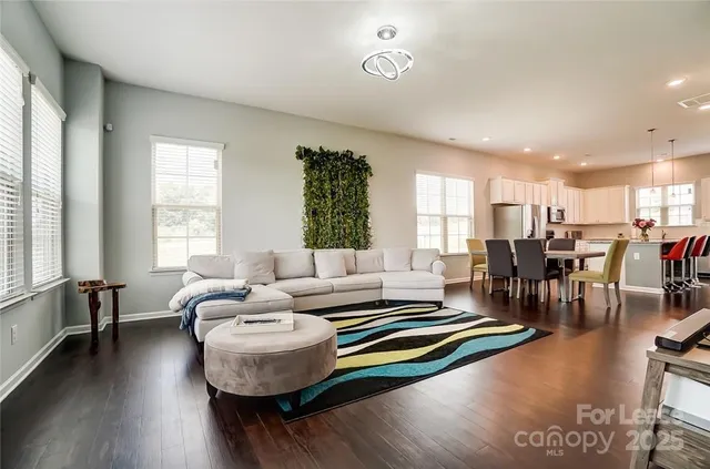 a living room with furniture and a table