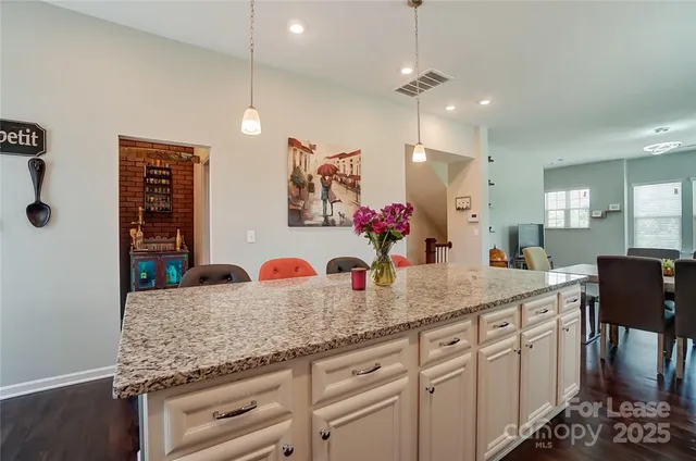 a kitchen with cabinets and window