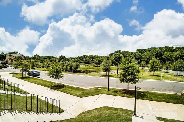 a view of a street with a yard