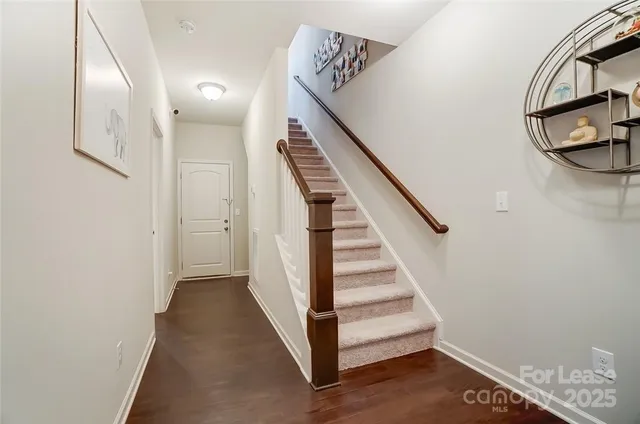 a view of a hallway with staircase
