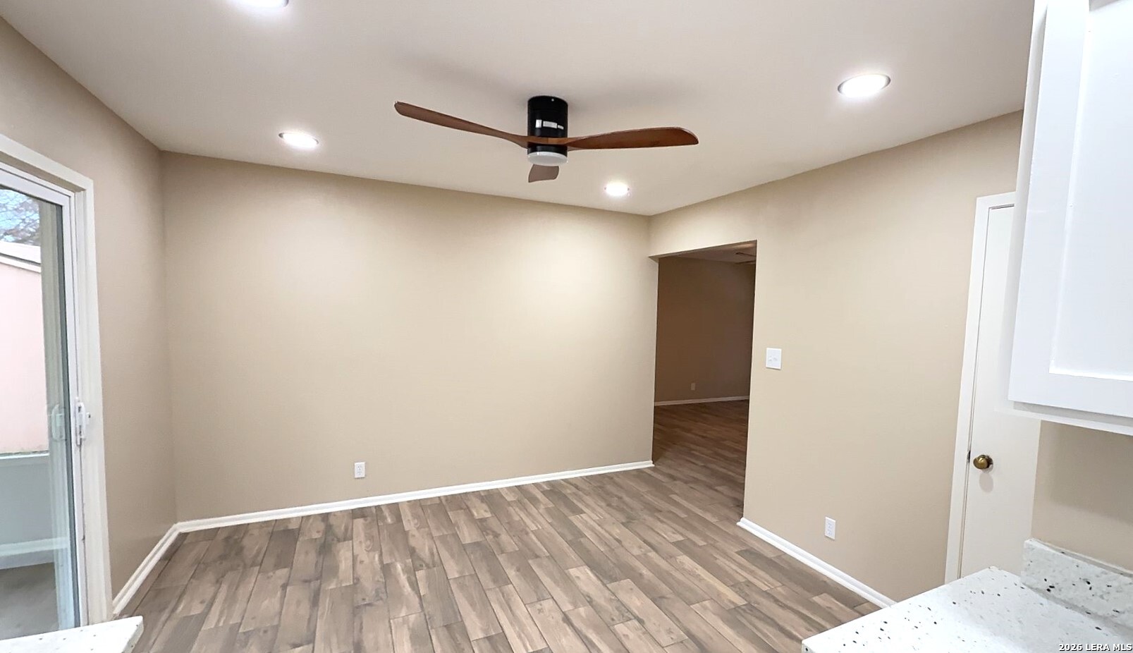 4119 Ramsgate Street San Antonio, TX 78230 - Photo 3 of 14 wooden floor in an empty room with a window