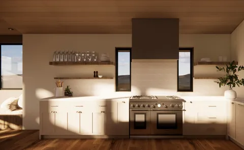 a kitchen with stainless steel appliances kitchen island a stove a sink and a refrigerator