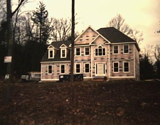 2 High Ridge Road Southbury, CT 06488 - Photo 1 of 1 a front view of a house with a yard