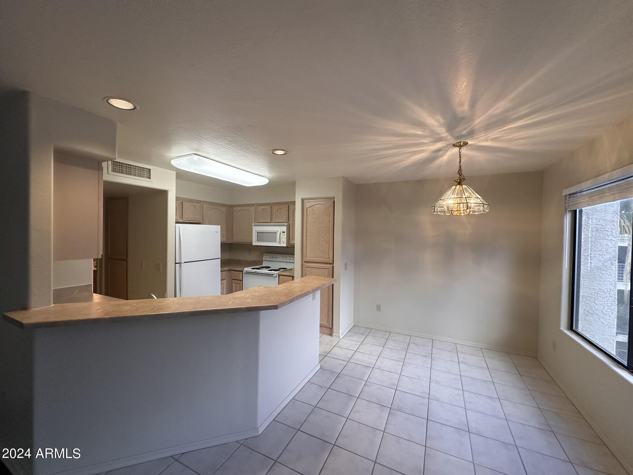 16715 East El Lago Boulevard, Unit 214 Fountain Hills, AZ 85268 - Photo 2 of 17 Kitchen and Eat In Area