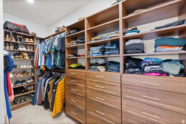 6208 West Bull River Road Highland, UT 84003 - Photo 38 of 90 Custom closet system featuring wood-finish shelving, multiple hanging rods, and integrated drawer storage