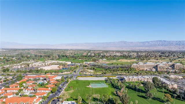 a view of a city with lush green forest