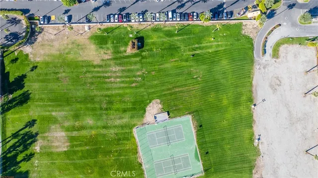 an aerial view of residential houses and outdoor space