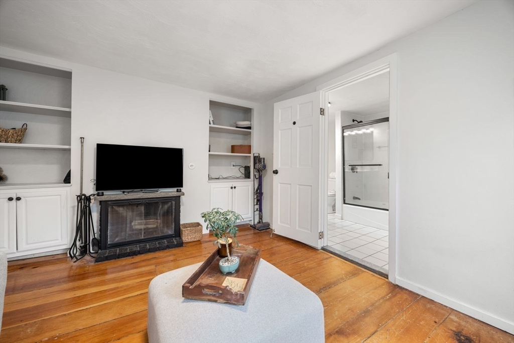 4 Mead St Court Boston, MA 02129 - Photo 11 of 29 a living room with furniture and a flat screen tv