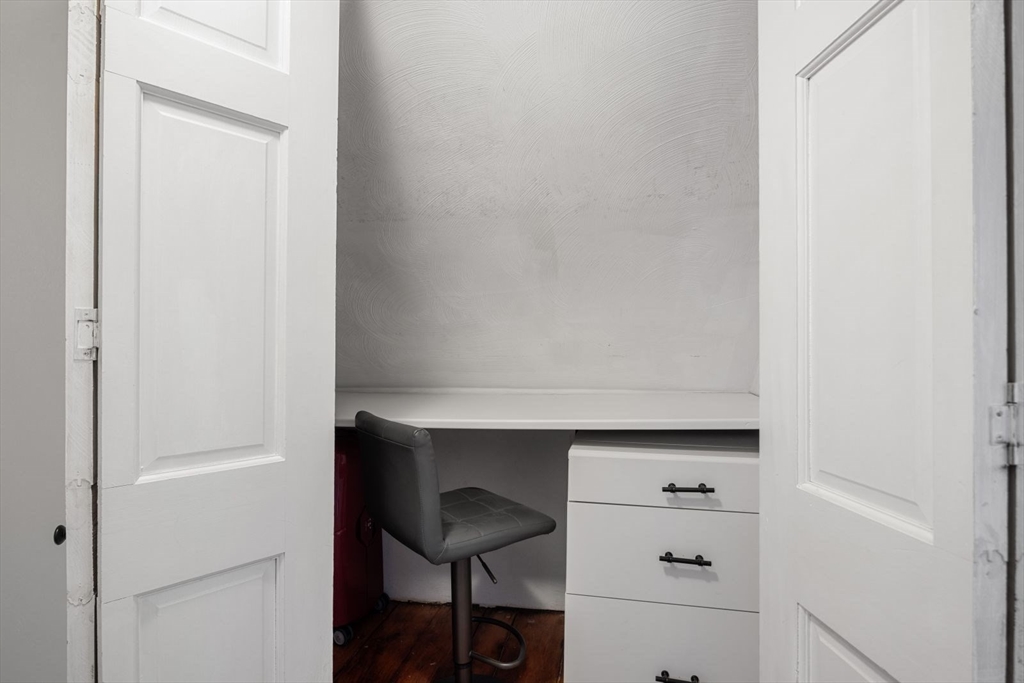 4 Mead St Court Boston, MA 02129 - Photo 20 of 29 a room with a bench and cabinets