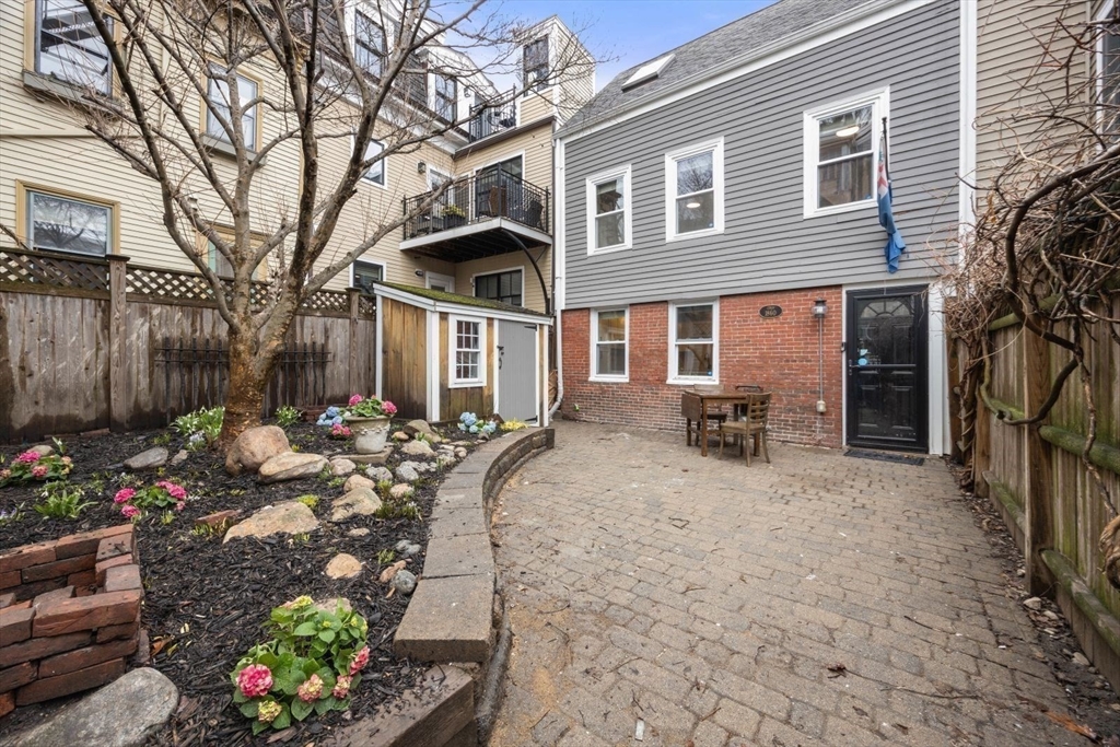 4 Mead St Court Boston, MA 02129 - Photo 24 of 29 a front view of a house with a patio