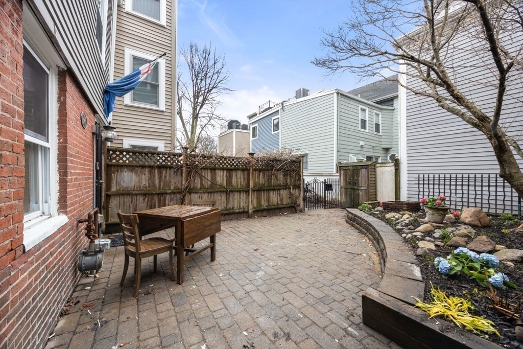 4 Mead St Court Boston, MA 02129 - Photo 25 of 29 a view of a chairs and table in the patio