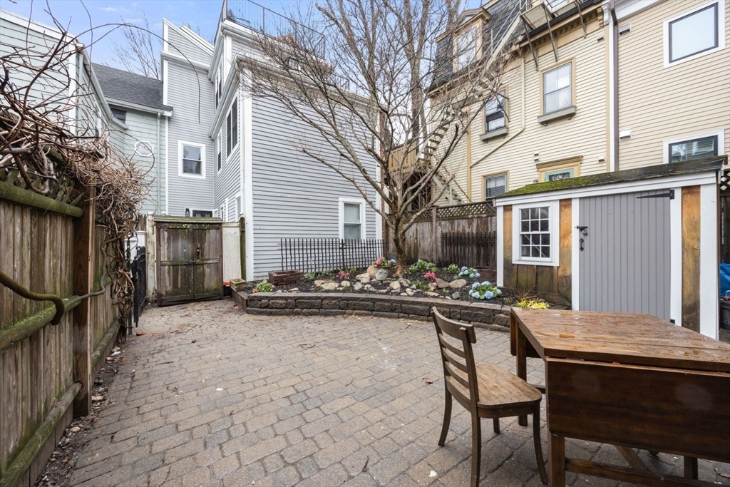 4 Mead St Court Boston, MA 02129 - Photo 26 of 29 a view of house with backyard and sitting area