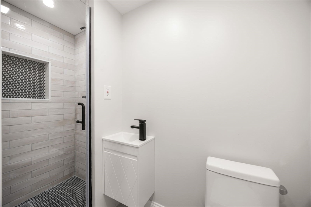 4 Mead St Court Boston, MA 02129 - Photo 7 of 29 a bathroom with a toilet and a sink