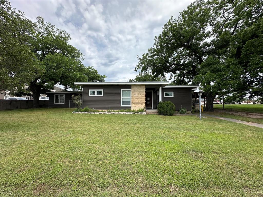 7350 Highway 67, Unit 377N Comanche, TX 76442 - Photo 2 of 13 a view of a house with a garden