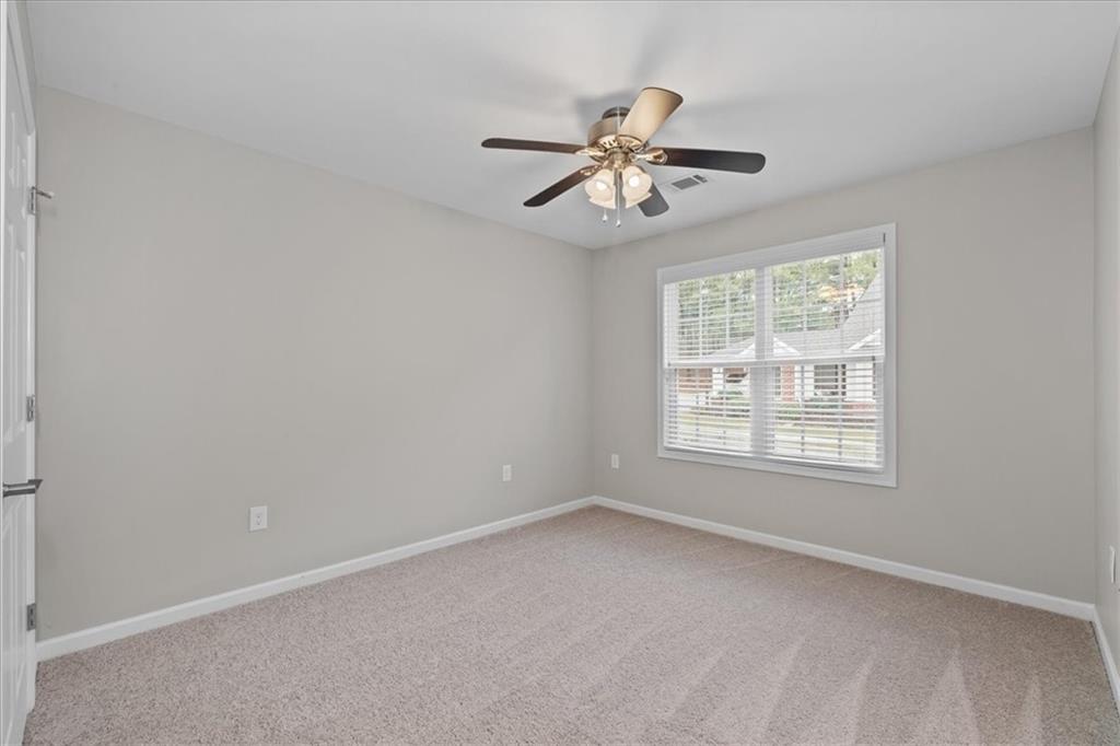 150 Old Mill Road, Unit 435 Cartersville, GA 30120 - Photo 15 of 22 an empty room with a window and a fan
