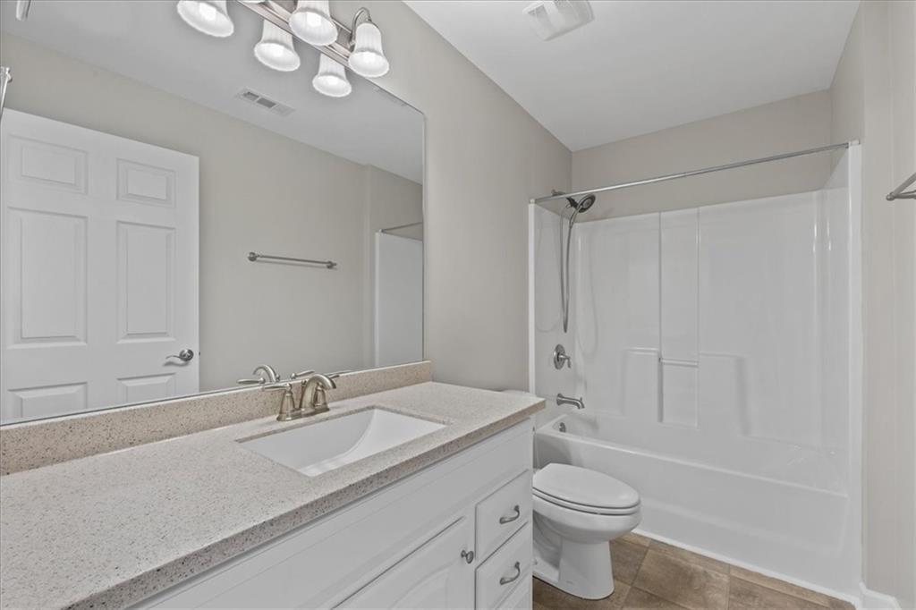 150 Old Mill Road, Unit 435 Cartersville, GA 30120 - Photo 17 of 22 a bathroom with a sink a toilet and shower