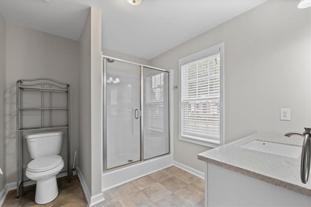 150 Old Mill Road, Unit 435 Cartersville, GA 30120 - Photo 20 of 22 a bathroom with a sink a toilet and shower