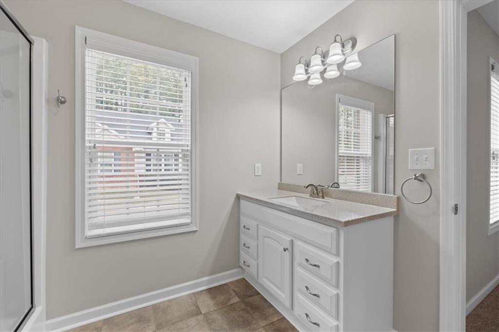 150 Old Mill Road, Unit 435 Cartersville, GA 30120 - Photo 21 of 22 a bathroom with a sink a large mirror and a window